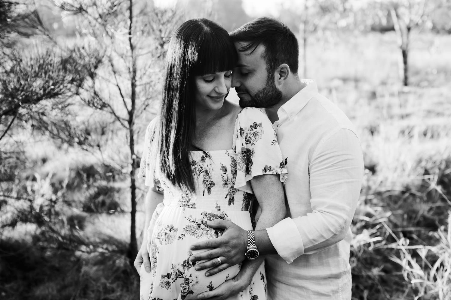 couple-in-field-romantic-maternity-images-mother-kissing-newborn-baby-brisbane-maternity-photography-packages