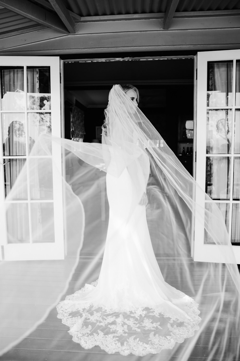 bride-wearing-a-viel-floating-spicers-hidden-veil-magic-quince-and-mulberry-studios-wedding-packages