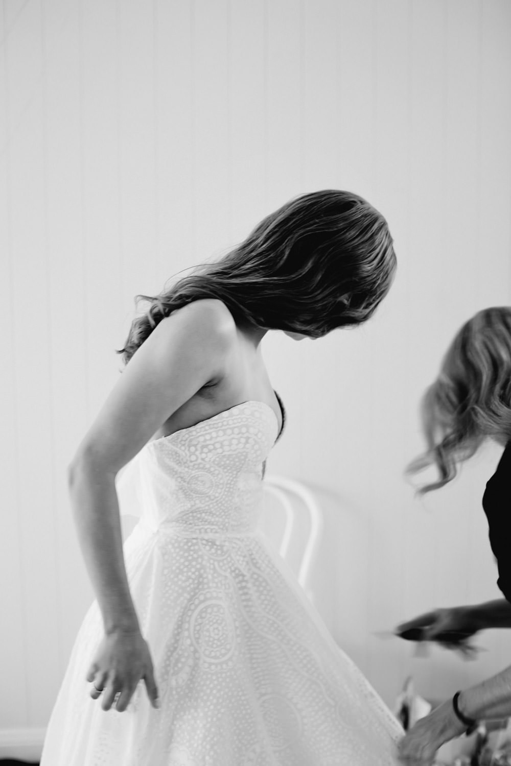 Judy-copley-finishing-touches-for-bridal-collection-runway-show-small-business-photography