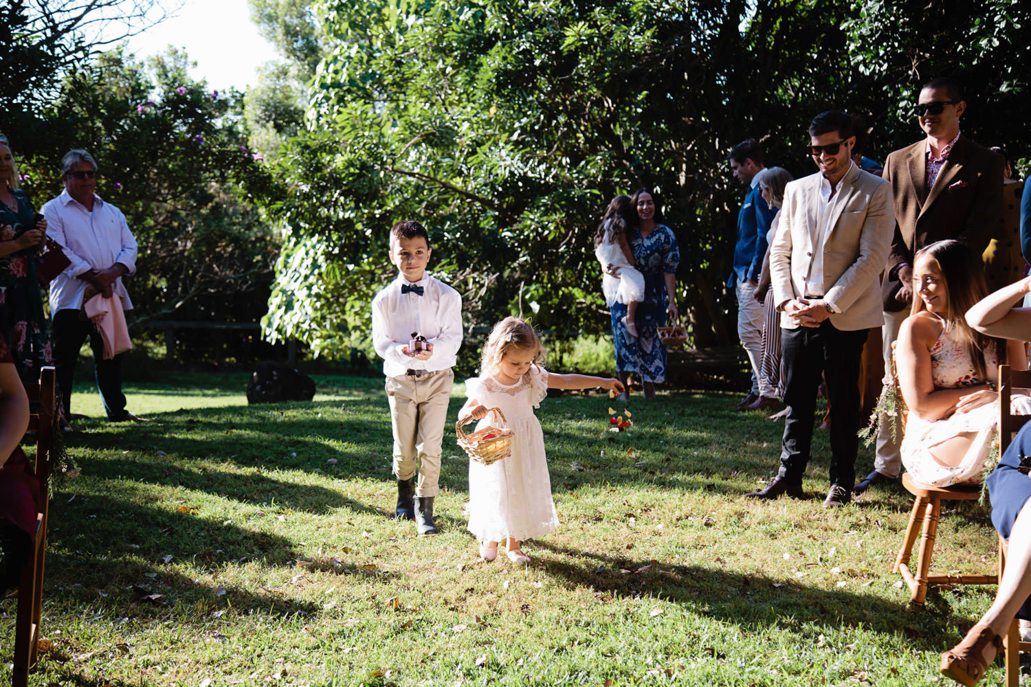flower-girl-arriving-at-ceremony_Ewingsdale-Hall_Byron_Bay-Wedding-QuincenmulberryStudios