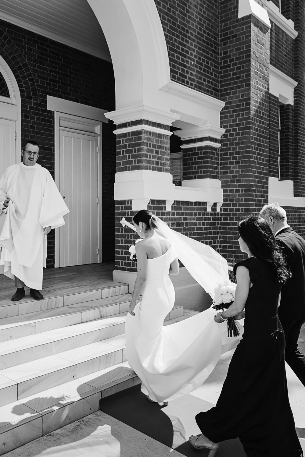 Bride-walkin-into-sacred-heart-rosalie-church-Brisbane-City-Wedding-Quincenmulberrystudios